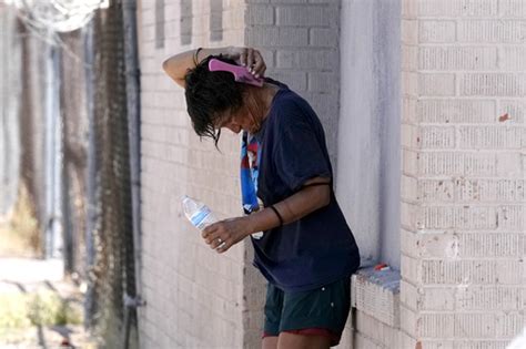 Little relief in sight from onslaught of searing heat and rising floodwaters in parts of US, 2 dead